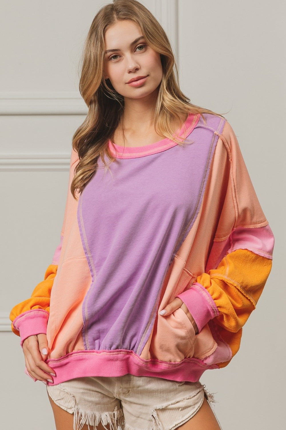 BiBi Color Block Exposed Seam Sweatshirt with Pockets Lavender Peach Fuchsia Tops/Jackets/Sweaters BiBi Clothing Tops Ship from USA TikTok Trendsi USPS Walmart Trendsi https://www.cyberehub.com